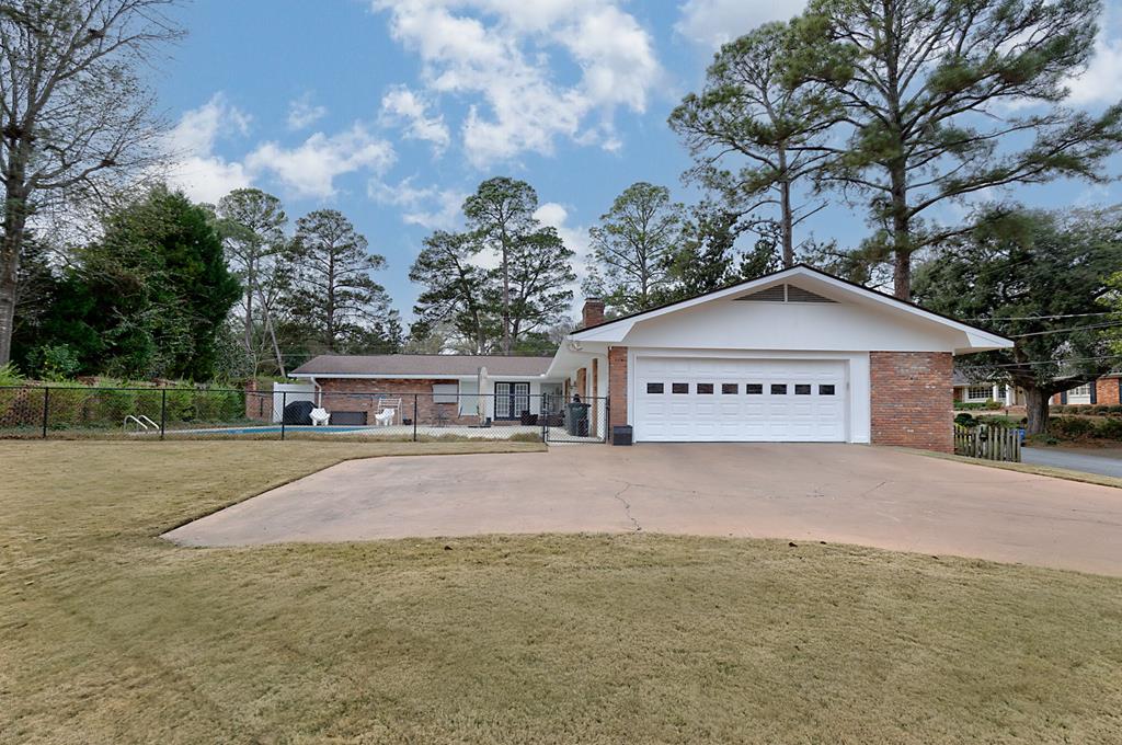 2008 Stark Avenue Columbus, GA 31906 - Photo 6 of 32 a view of a house with a yard and garage