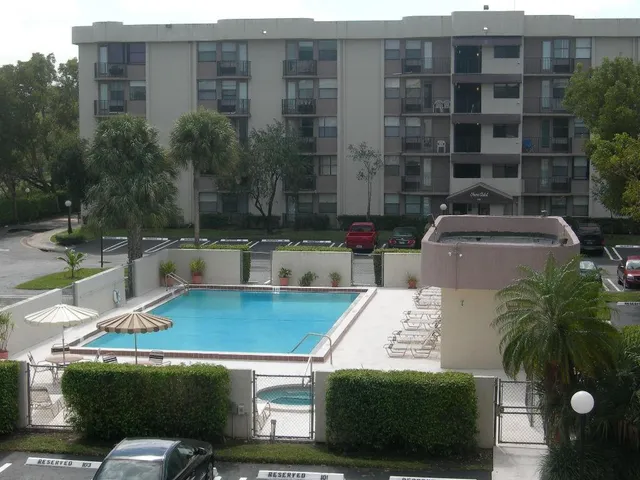 a view of a patio with couches and potted plants