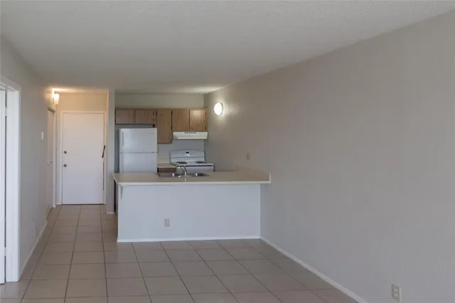 a view of a kitchen with a sink