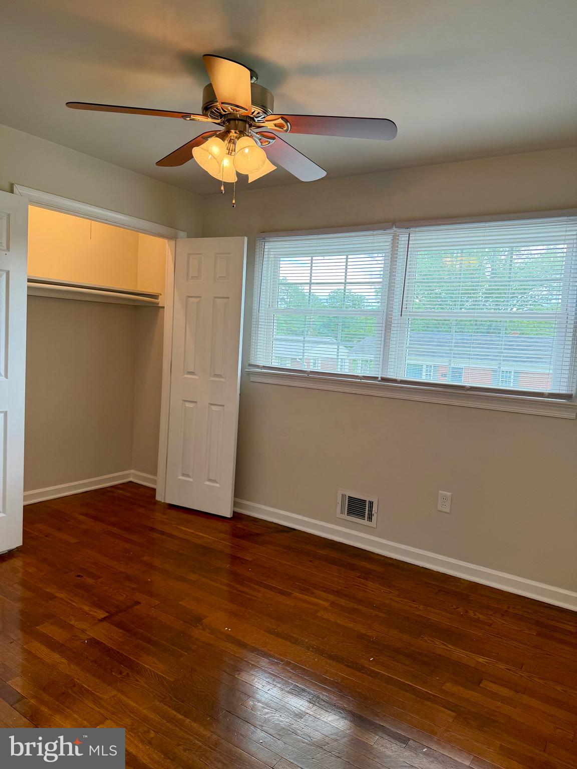 1010 Nottingham Street Culpeper, VA 22701 - Photo 11 of 21 an empty room with wooden floor and windows