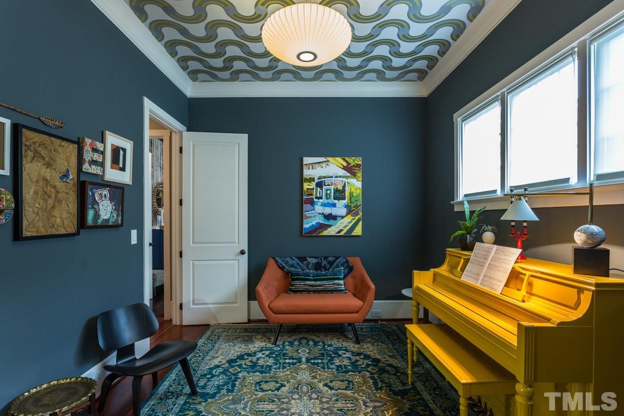 910 West Johnson Street Raleigh, NC 27605 - Photo 16 of 30 a living room with furniture and a large window