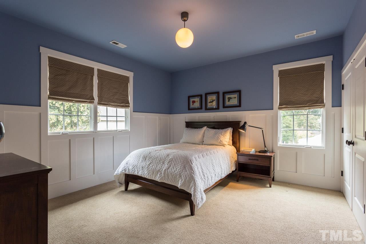 910 West Johnson Street Raleigh, NC 27605 - Photo 23 of 30 a bedroom with a bed and a window