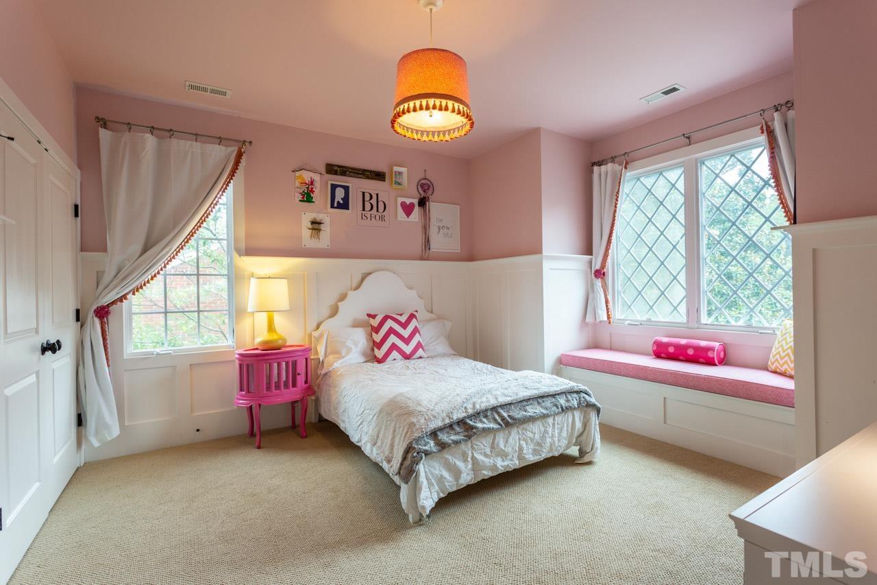 910 West Johnson Street Raleigh, NC 27605 - Photo 25 of 30 a bedroom with a bed and a window