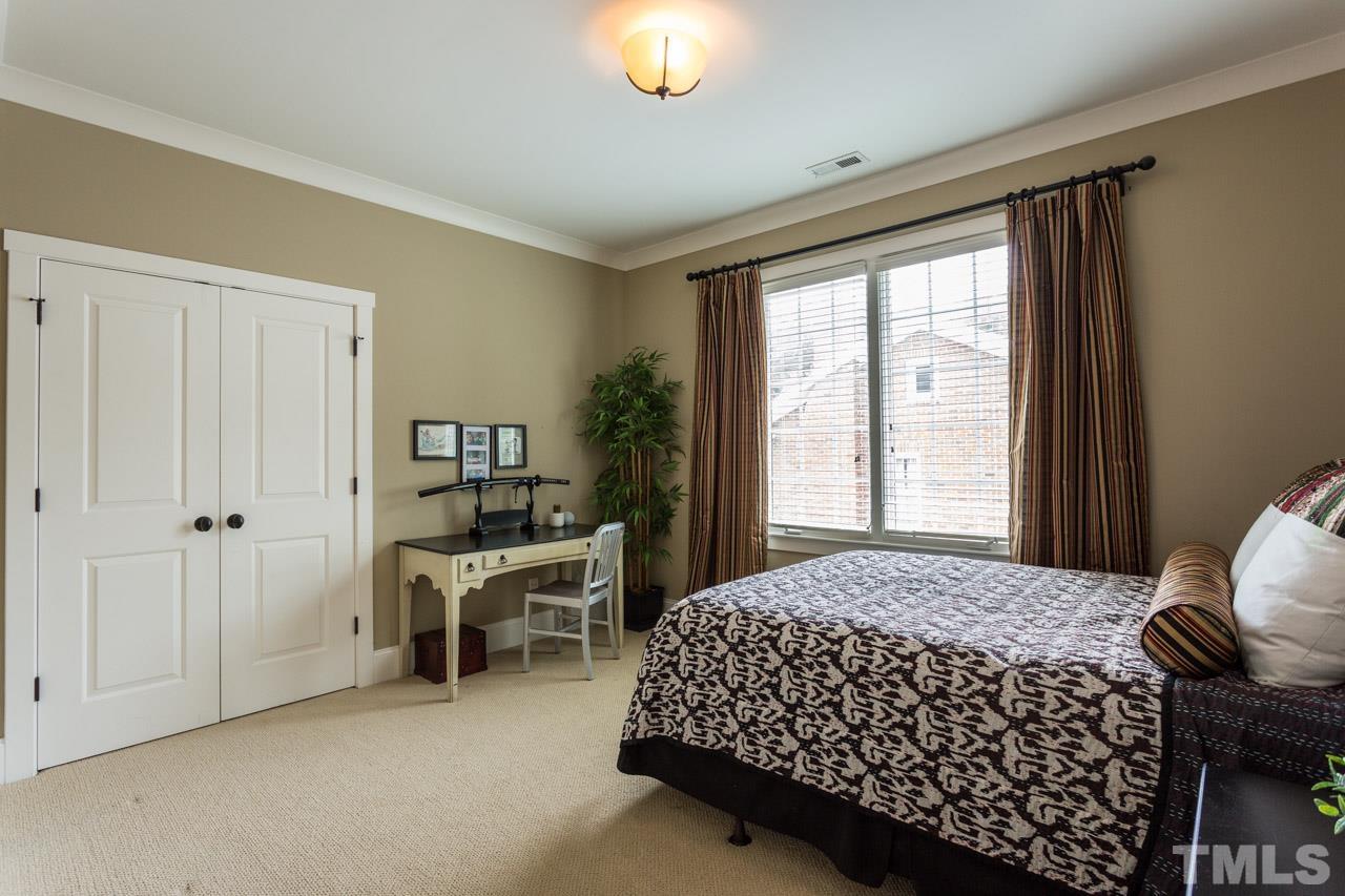 910 West Johnson Street Raleigh, NC 27605 - Photo 26 of 30 a bedroom with a bed and a window