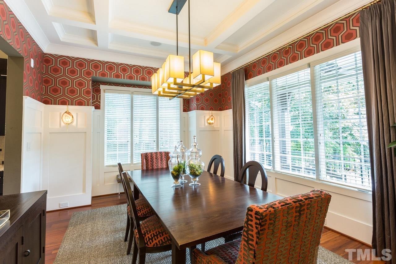 910 West Johnson Street Raleigh, NC 27605 - Photo 3 of 30 a view of a dining room with furniture wooden floor and chandelier