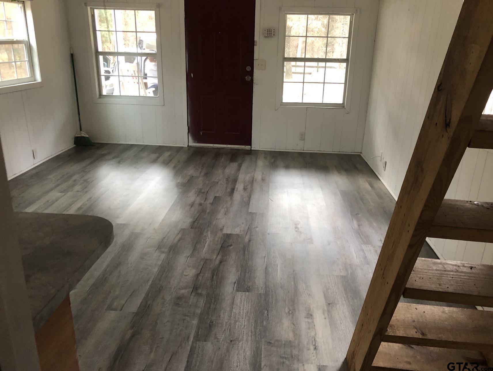 347 Sabinal Street Bullard, TX 75757 - Photo 5 of 6 an empty room with wooden floor and windows
