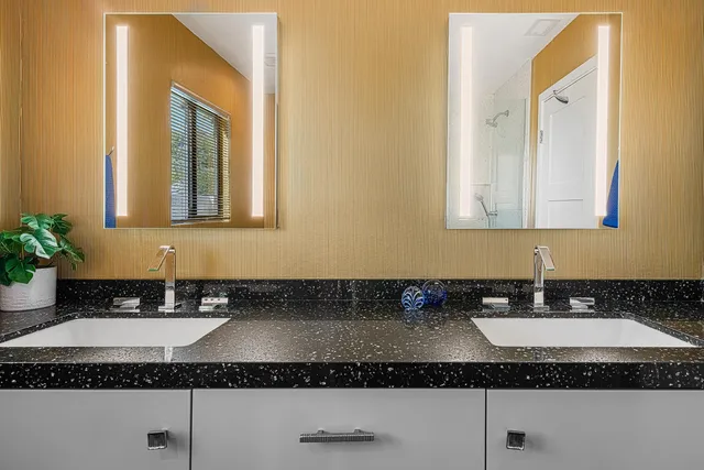 a bathroom with sink and mirror