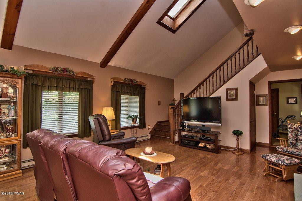 1 East Lake Road Moscow, PA 18444 - Photo 48 of 88 a living room with furniture and a flat screen tv