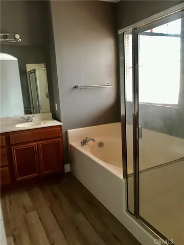 a bathroom with a bathtub and a sink