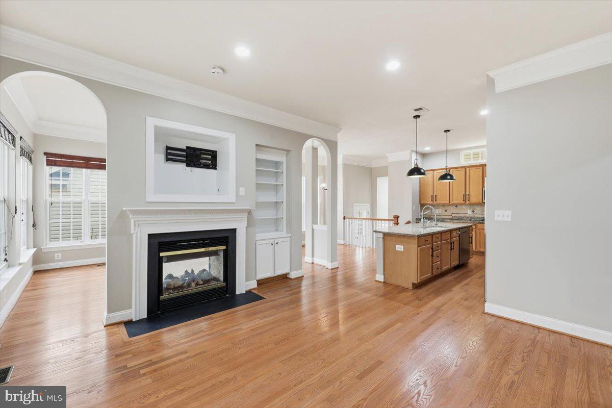 23706 Grapevine Ridge Terrace Clarksburg, MD 20871 - Photo 11 of 39 a view of kitchen with granite countertop stove top oven and cabinets