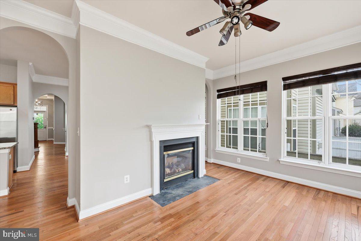 23706 Grapevine Ridge Terrace Clarksburg, MD 20871 - Photo 12 of 39 a view of an empty room with wooden floor and a window