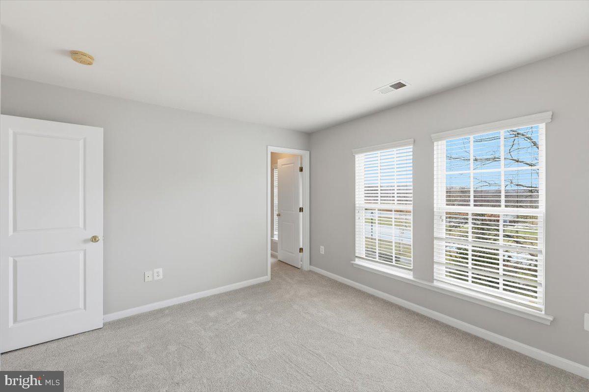 23706 Grapevine Ridge Terrace Clarksburg, MD 20871 - Photo 26 of 39 a view of an empty room with a window