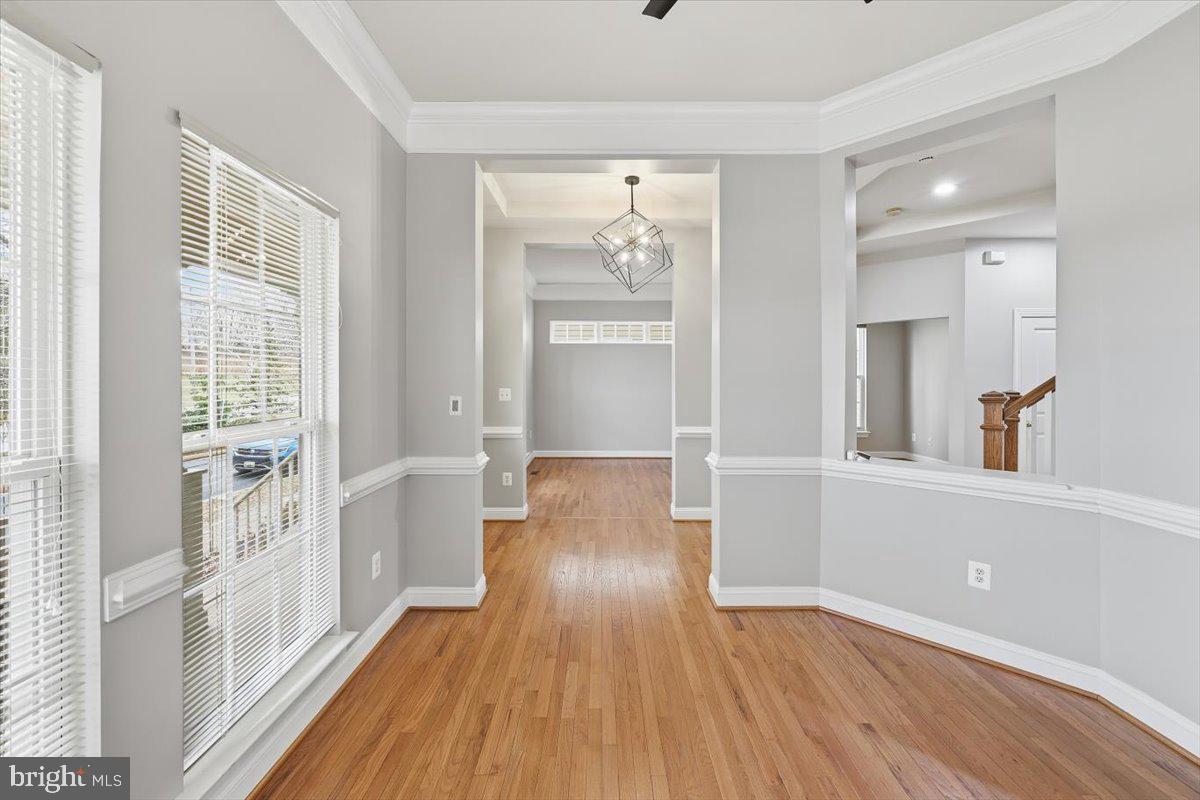 23706 Grapevine Ridge Terrace Clarksburg, MD 20871 - Photo 4 of 39 wooden floor in an empty room with a window