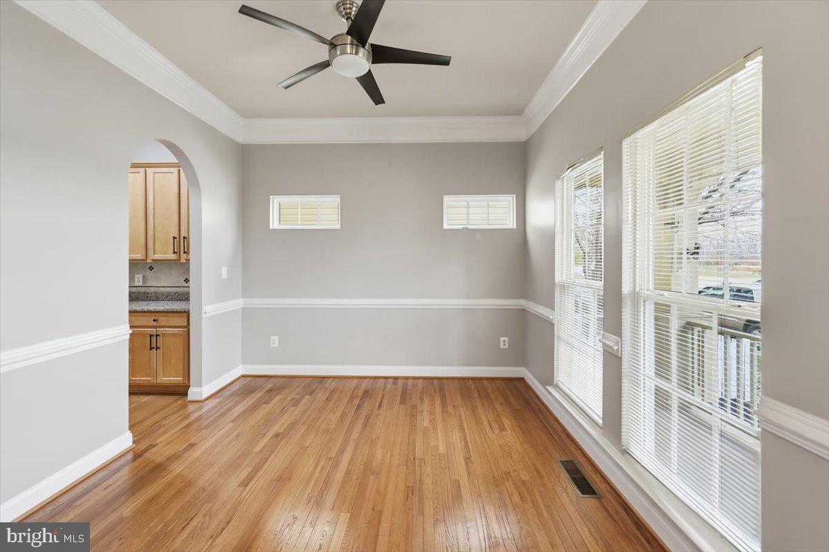 23706 Grapevine Ridge Terrace Clarksburg, MD 20871 - Photo 7 of 39 a view of empty room with wooden floor and fan