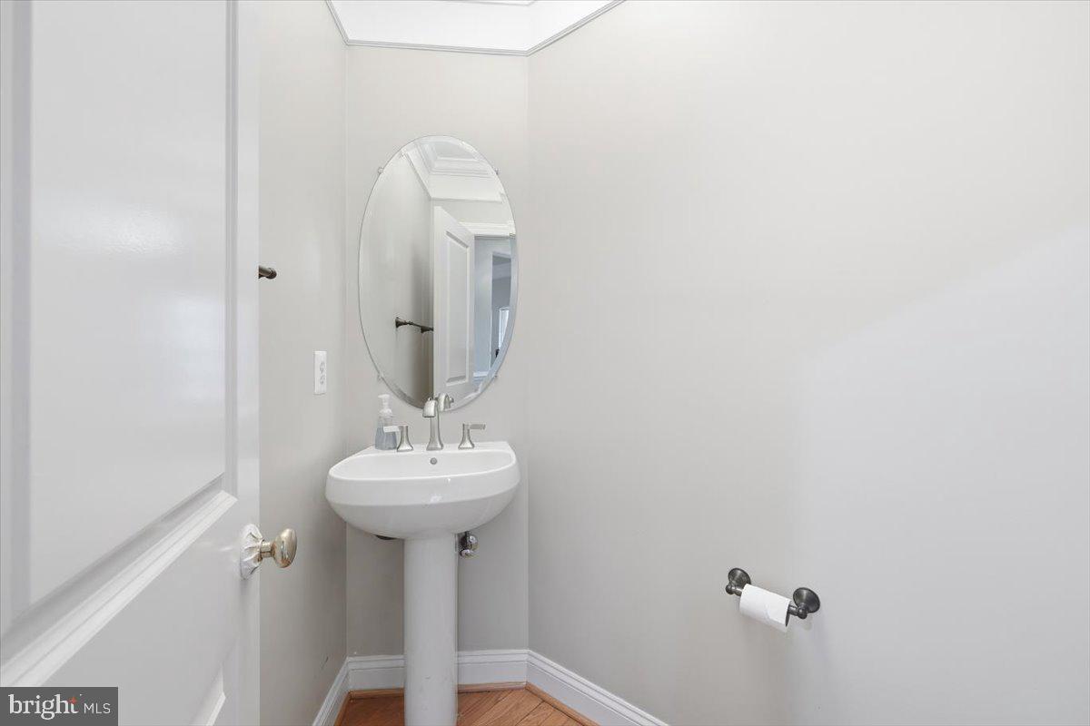 23706 Grapevine Ridge Terrace Clarksburg, MD 20871 - Photo 9 of 39 a bathroom with a sink a mirror and shower