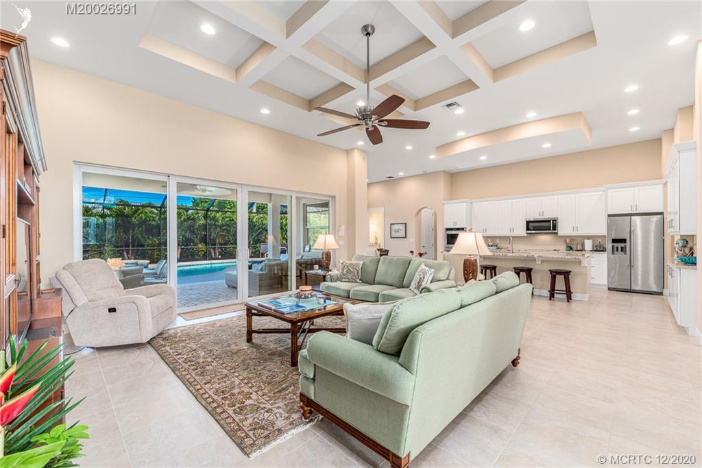 4981 Southeast Inlet Isle Way Stuart, FL 34997 - Photo 16 of 42 a living room with furniture and a large window