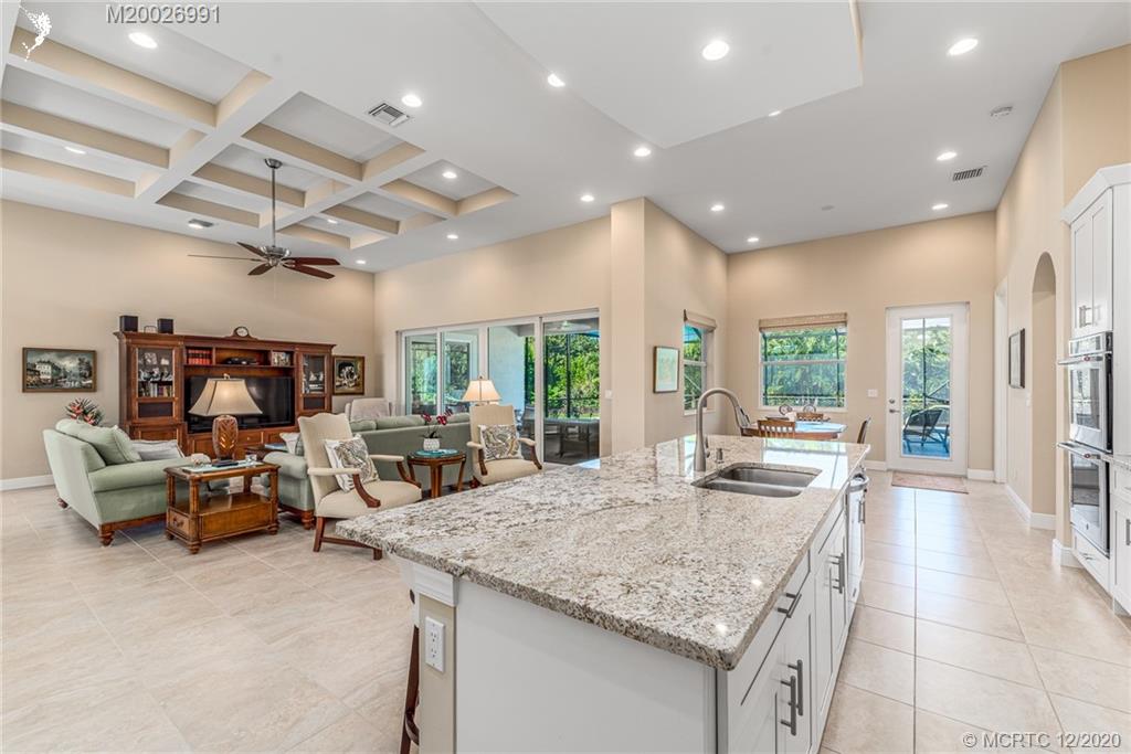 4981 Southeast Inlet Isle Way Stuart, FL 34997 - Photo 25 of 42 a view of a living room and kitchen