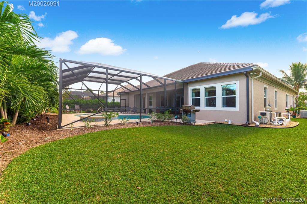 4981 Southeast Inlet Isle Way Stuart, FL 34997 - Photo 38 of 42 a view of a house with backyard porch and sitting area