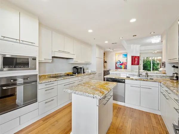 a spacious bathroom with a sink and a mirror