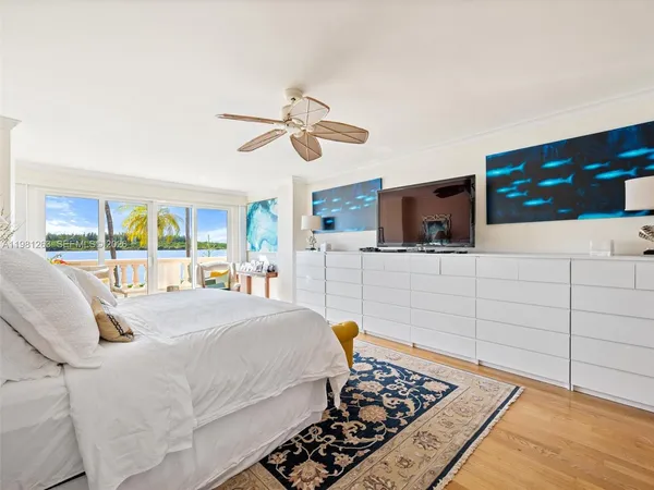 a bedroom with bed and window