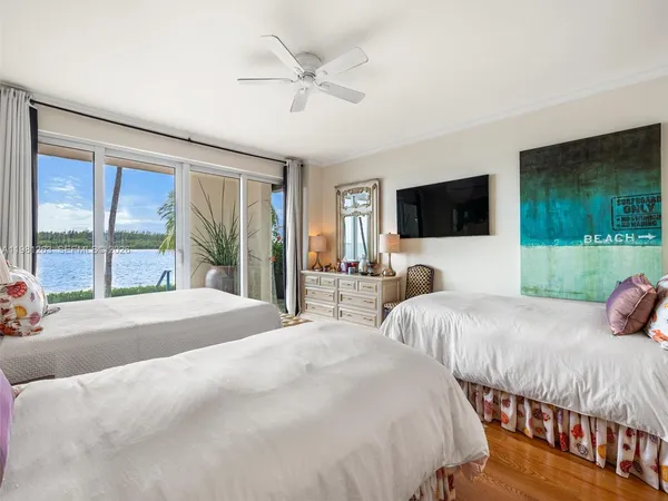 a bedroom with a bed and a lamp