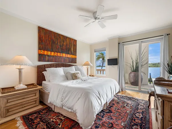 a bedroom with a bed and a television