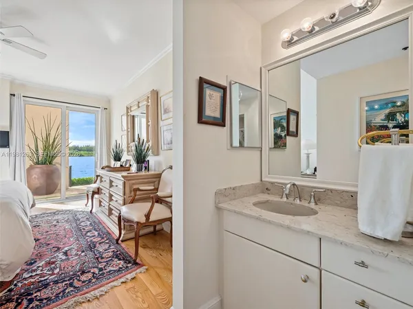 a bathroom with a shower sink mirror and toilet