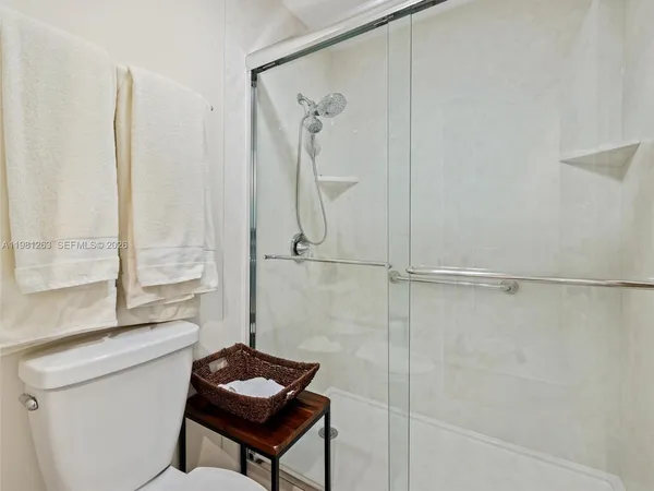 a kitchen with stove and refrigerator