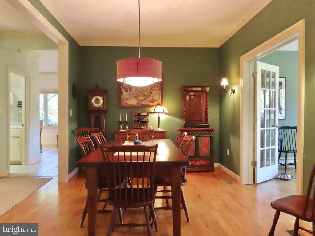 3016 Etlan Road Etlan, VA 22719 - Photo 18 of 42 Dining Room leads to the Sunroom at right