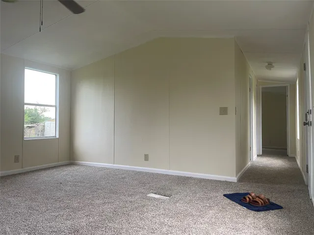 a view of an empty room and window