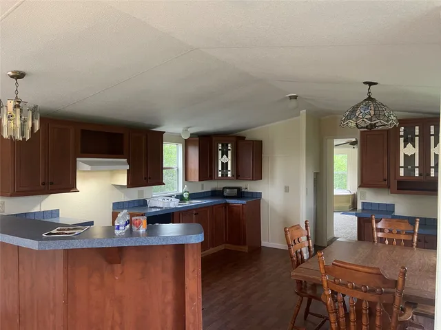 a kitchen with granite countertop lots of counter top space and dining table