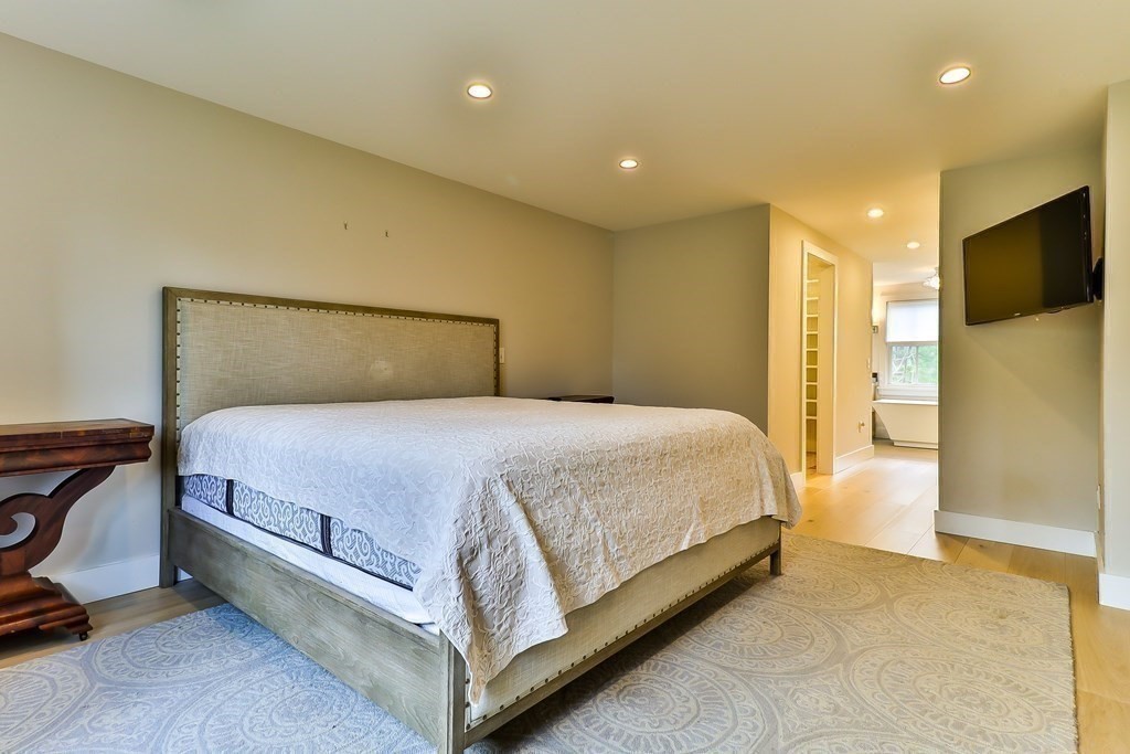 36 Captain Baker Road Marstons Mills, MA 02648 - Photo 15 of 36 a bed room with a bed and a television