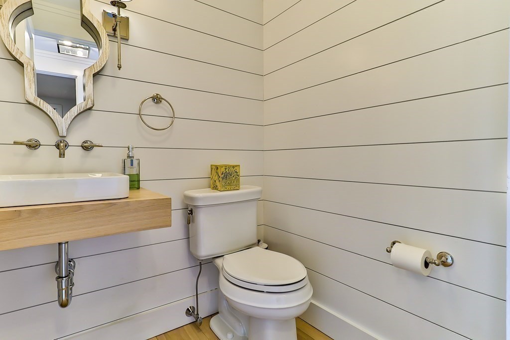 36 Captain Baker Road Marstons Mills, MA 02648 - Photo 19 of 36 a bathroom with a toilet sink and mirror