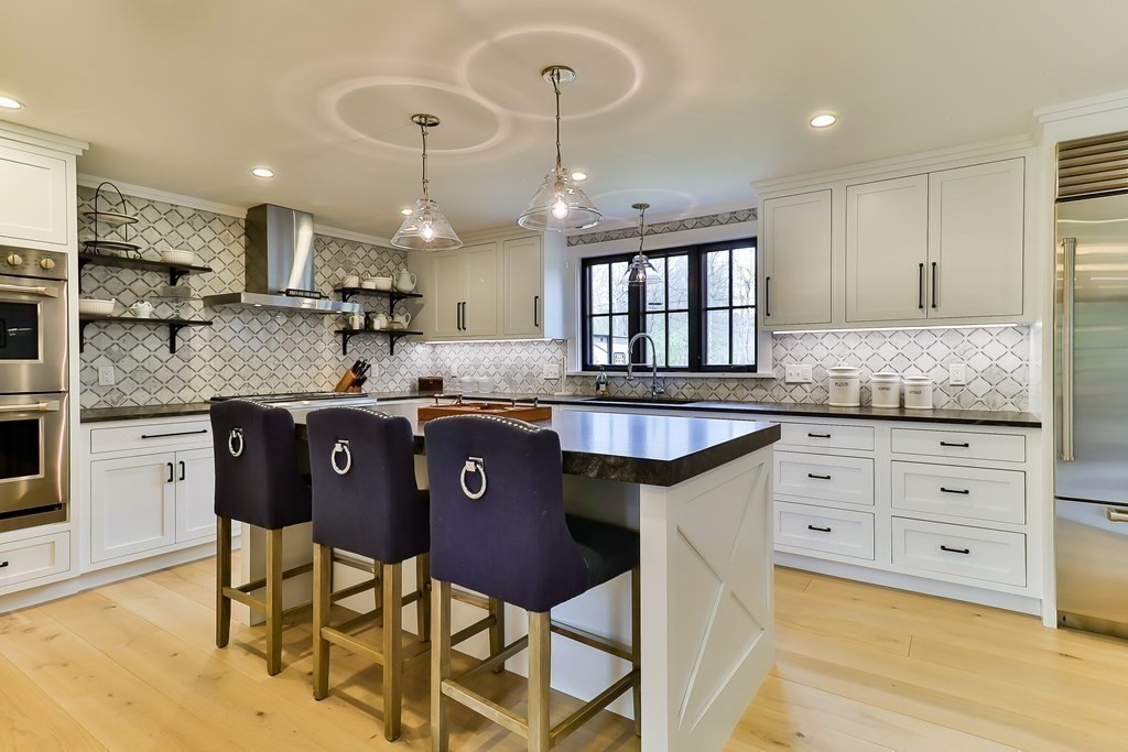 36 Captain Baker Road Marstons Mills, MA 02648 - Photo 2 of 36 a kitchen with granite countertop wooden cabinets and a granite counter tops