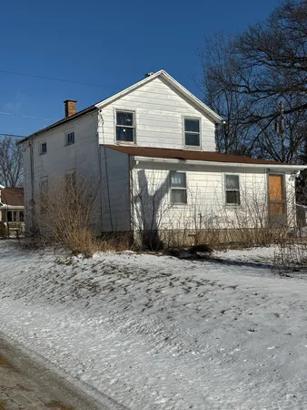 a front view of a house with garage