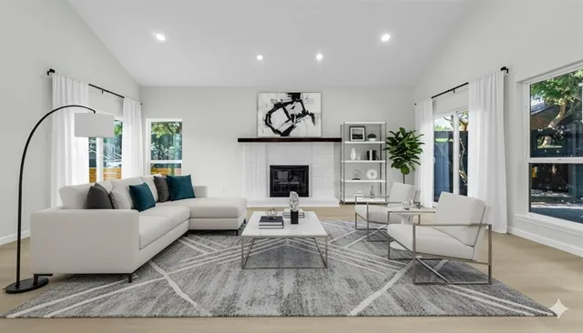 a living room with furniture and a fireplace