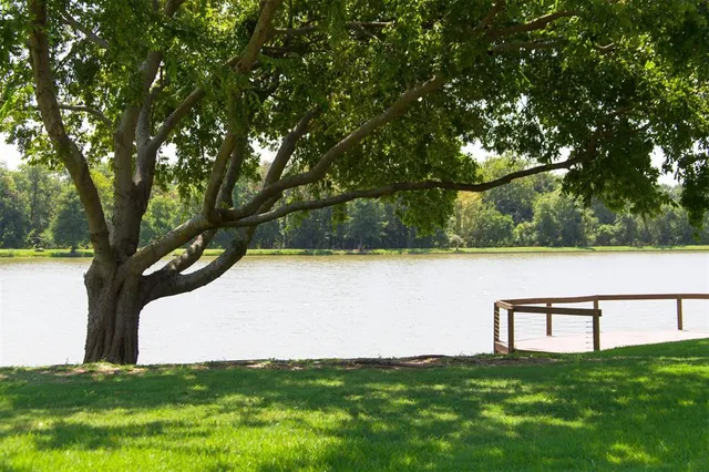 a view of lake with green field