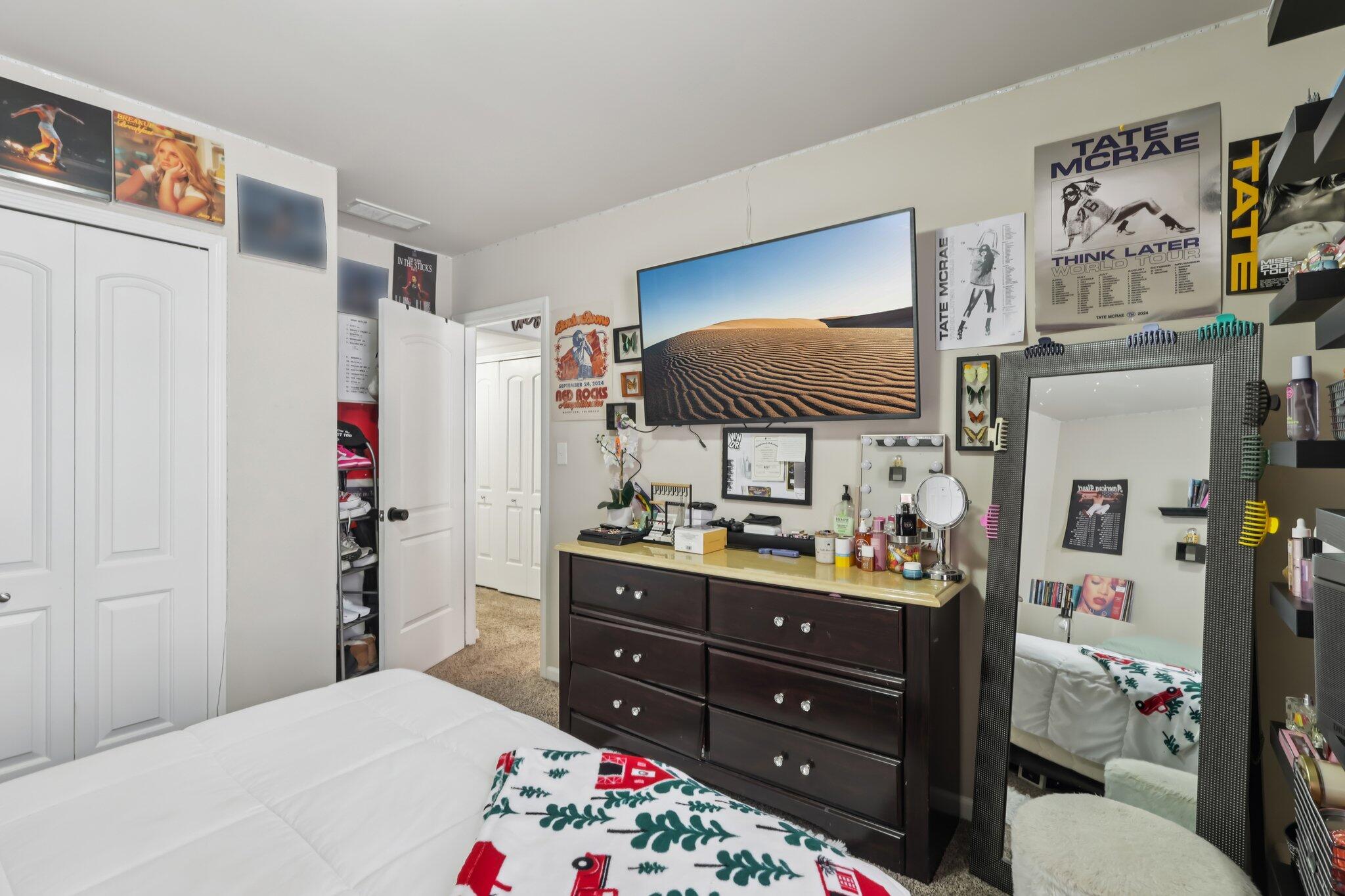 2235 Coldspring Road Crown Point, IN 46307 - Photo 17 of 51 a bed room with a bed and a flat tv screen
