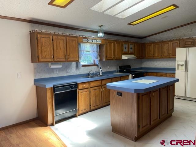 16022 B Road Delta, CO 81416 - Photo 7 of 35 a kitchen with a sink cabinets and wooden floor