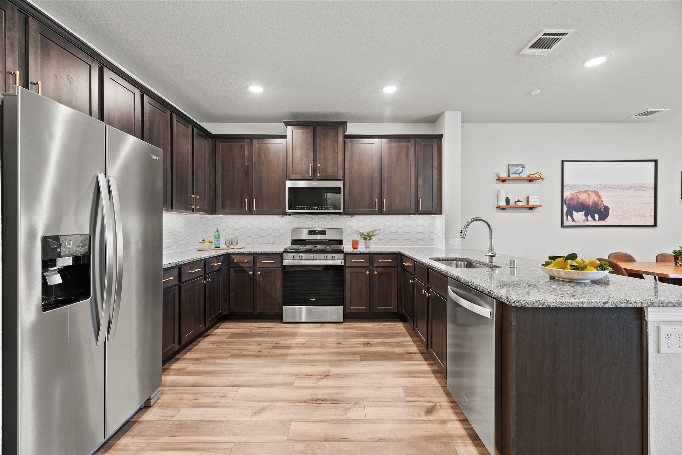 8001 Scanlan Trail Missouri City, TX 77459 - Photo 10 of 41 a kitchen with stainless steel appliances granite countertop a refrigerator and a sink