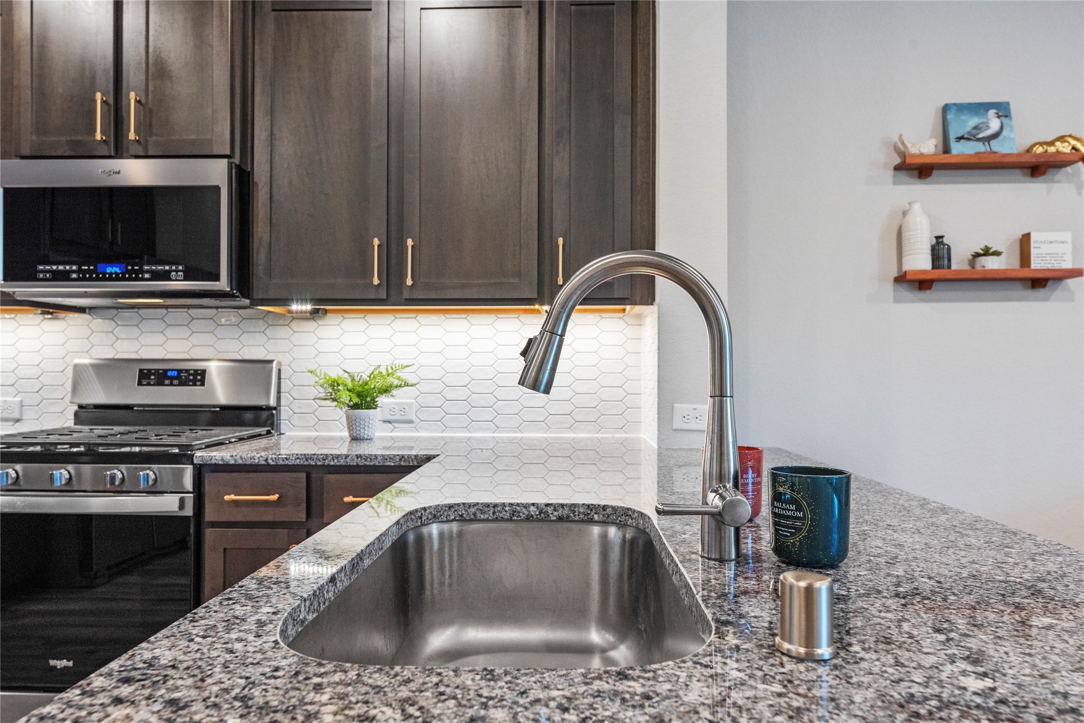 8001 Scanlan Trail Missouri City, TX 77459 - Photo 13 of 41 a kitchen with a sink a stove and cabinets