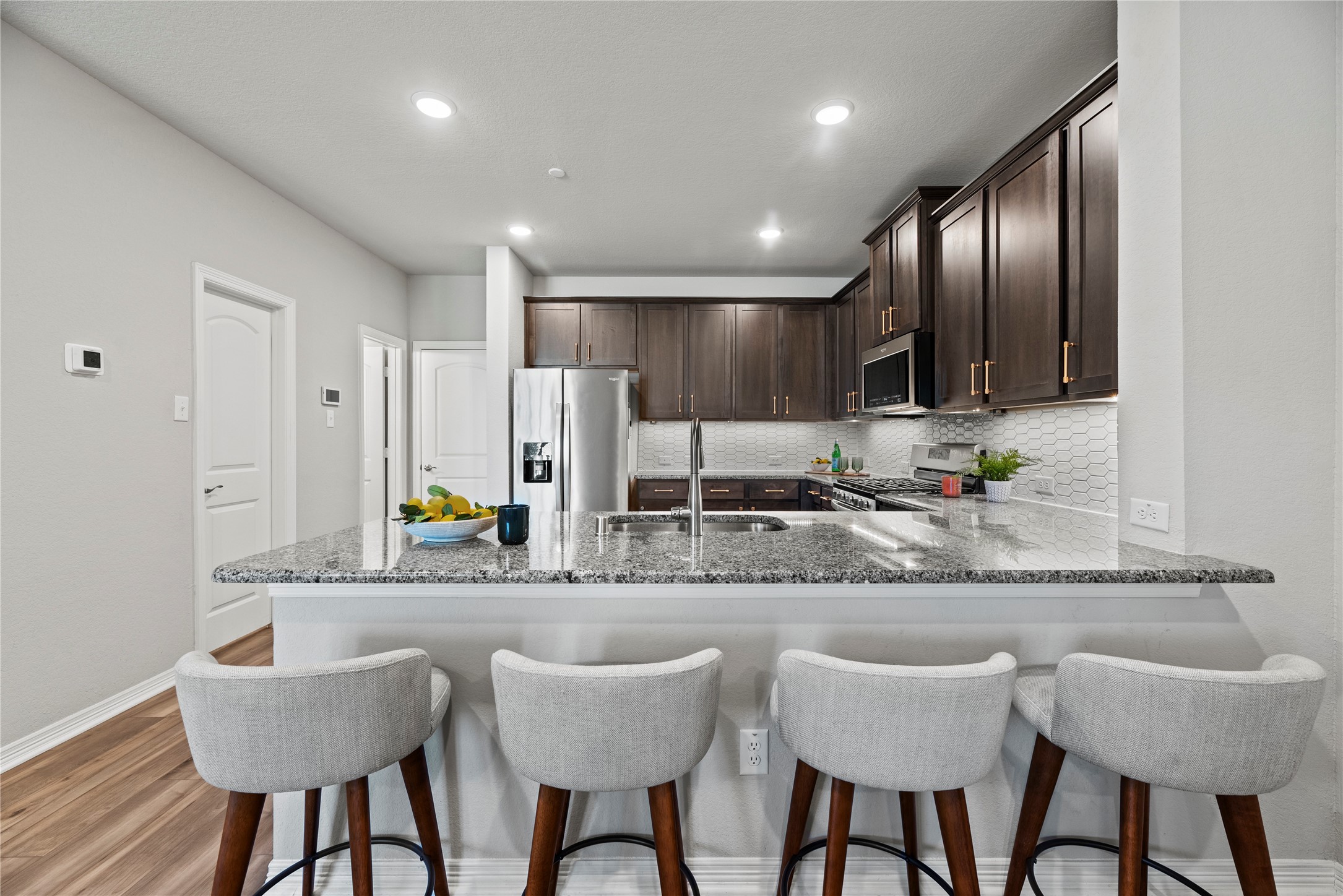 8001 Scanlan Trail Missouri City, TX 77459 - Photo 14 of 41 a kitchen with granite countertop counter space a sink stainless steel appliances and cabinets