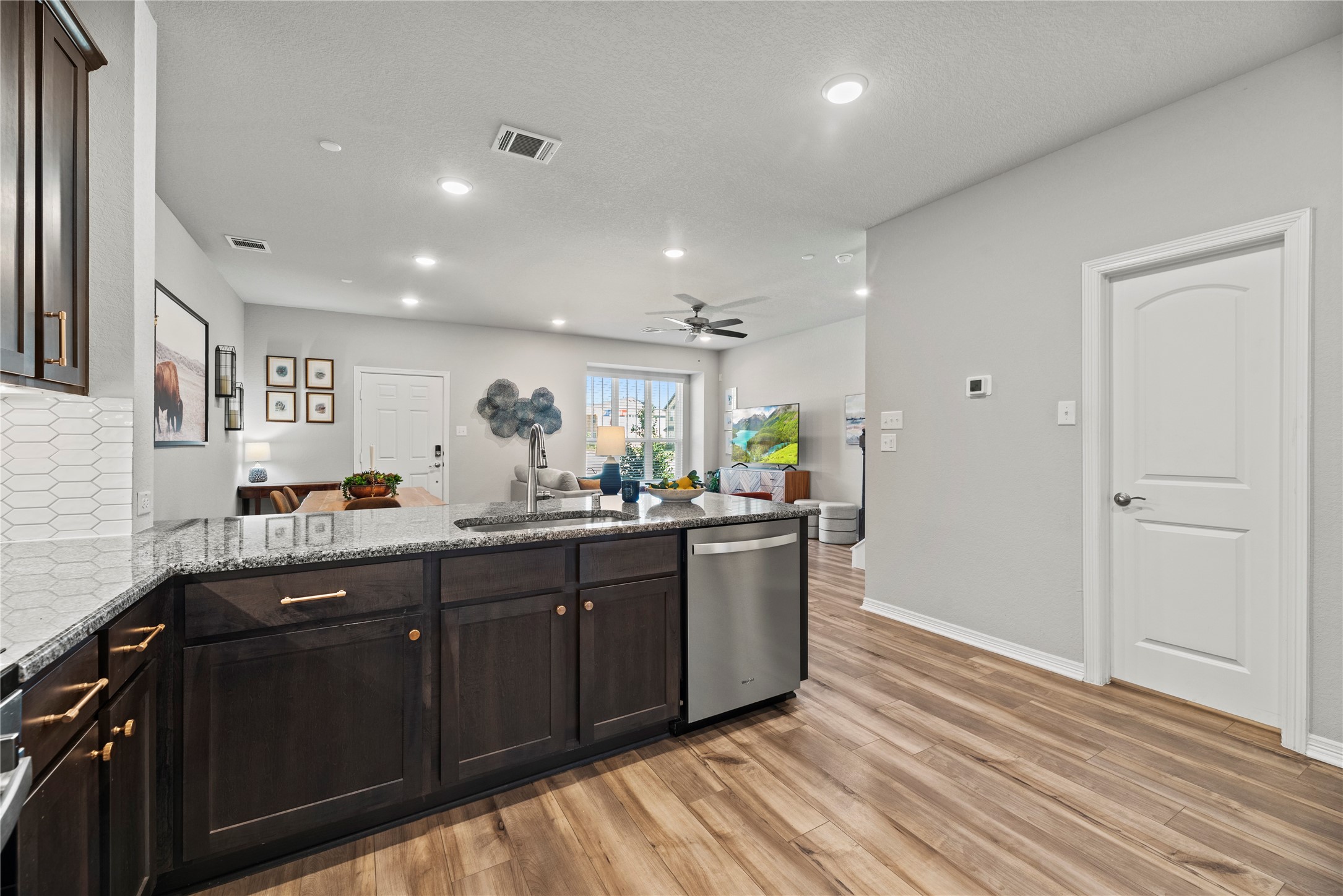 8001 Scanlan Trail Missouri City, TX 77459 - Photo 16 of 41 a kitchen with stainless steel appliances granite countertop a sink and cabinets