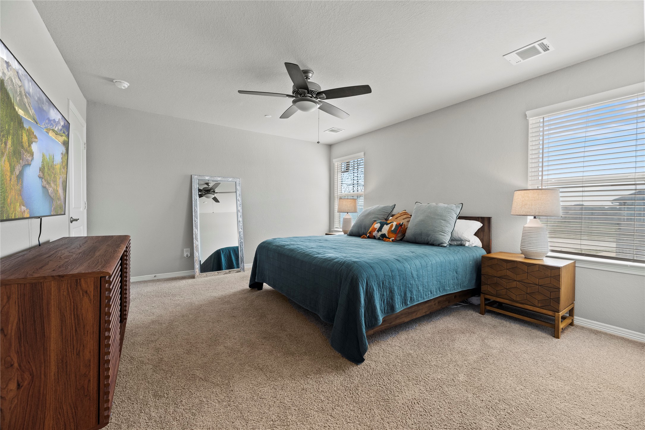 8001 Scanlan Trail Missouri City, TX 77459 - Photo 19 of 41 a bedroom with a bed and a flat screen tv