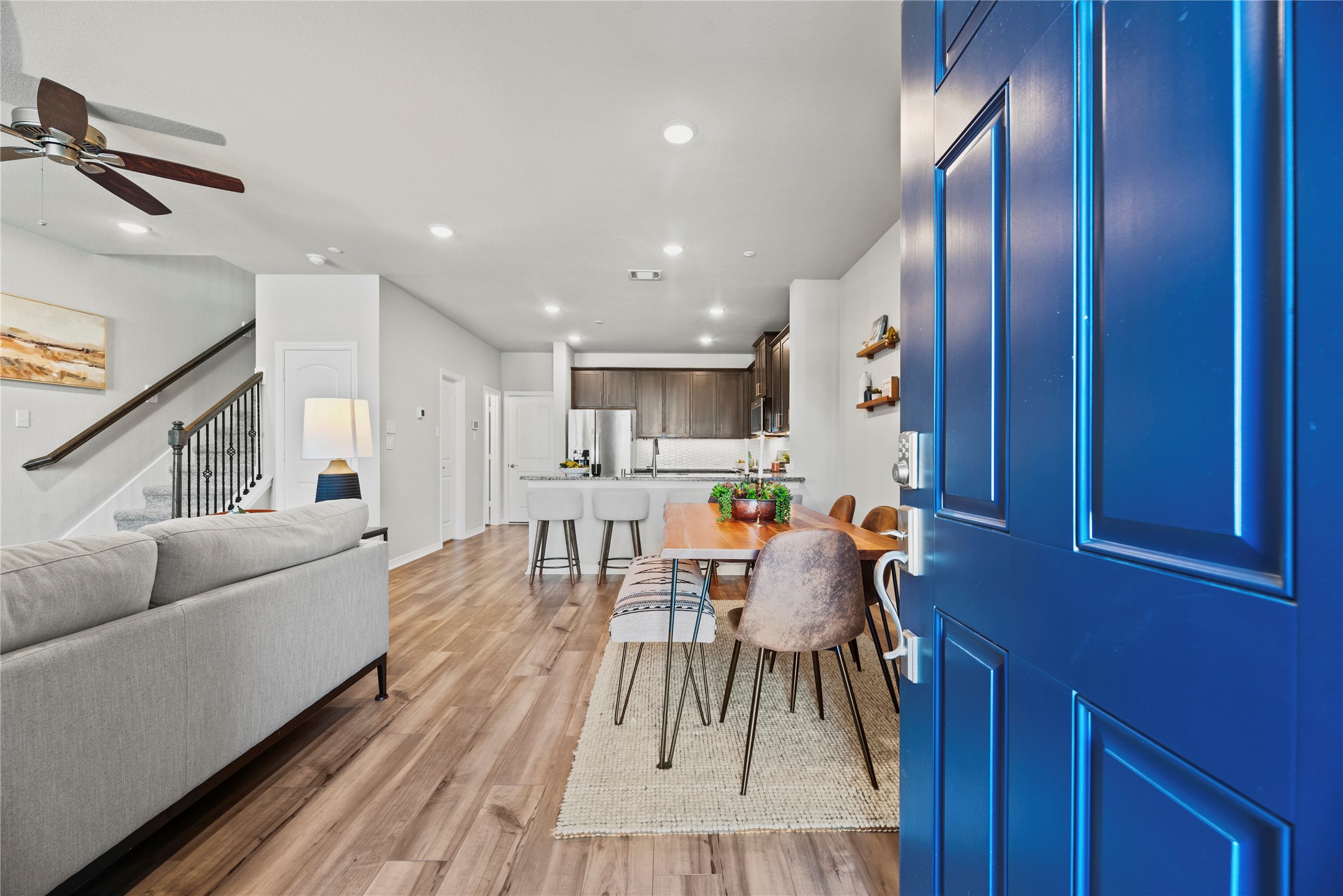 8001 Scanlan Trail Missouri City, TX 77459 - Photo 2 of 41 a living room with furniture and a wooden floor