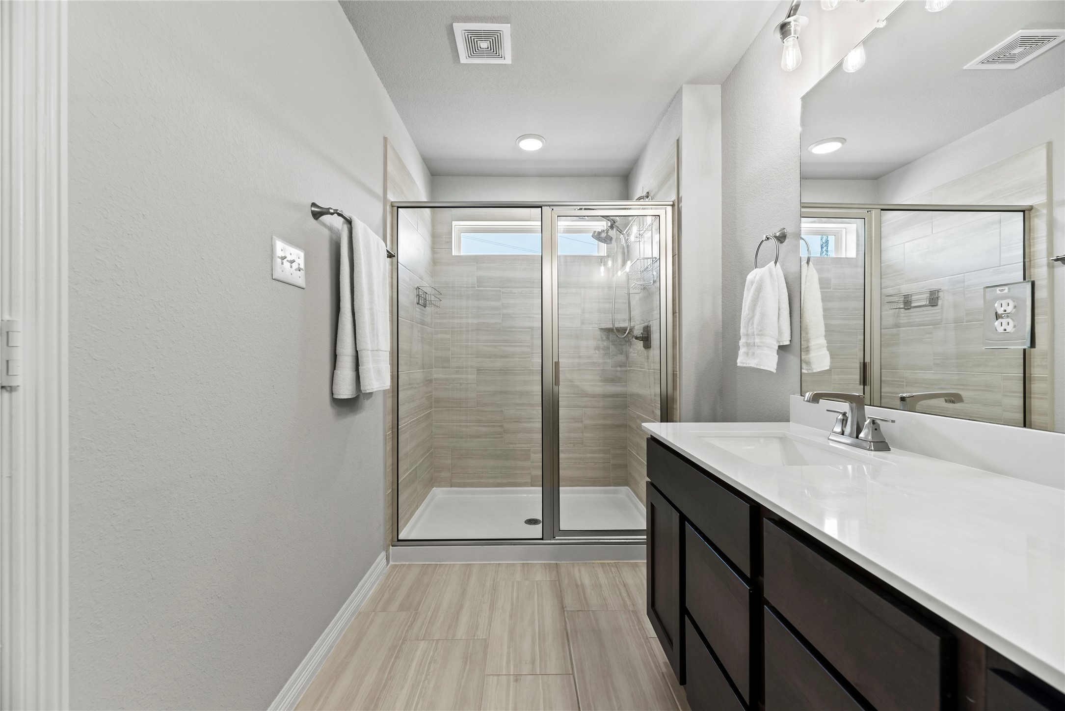 8001 Scanlan Trail Missouri City, TX 77459 - Photo 22 of 41 a bathroom with a shower sink and mirror