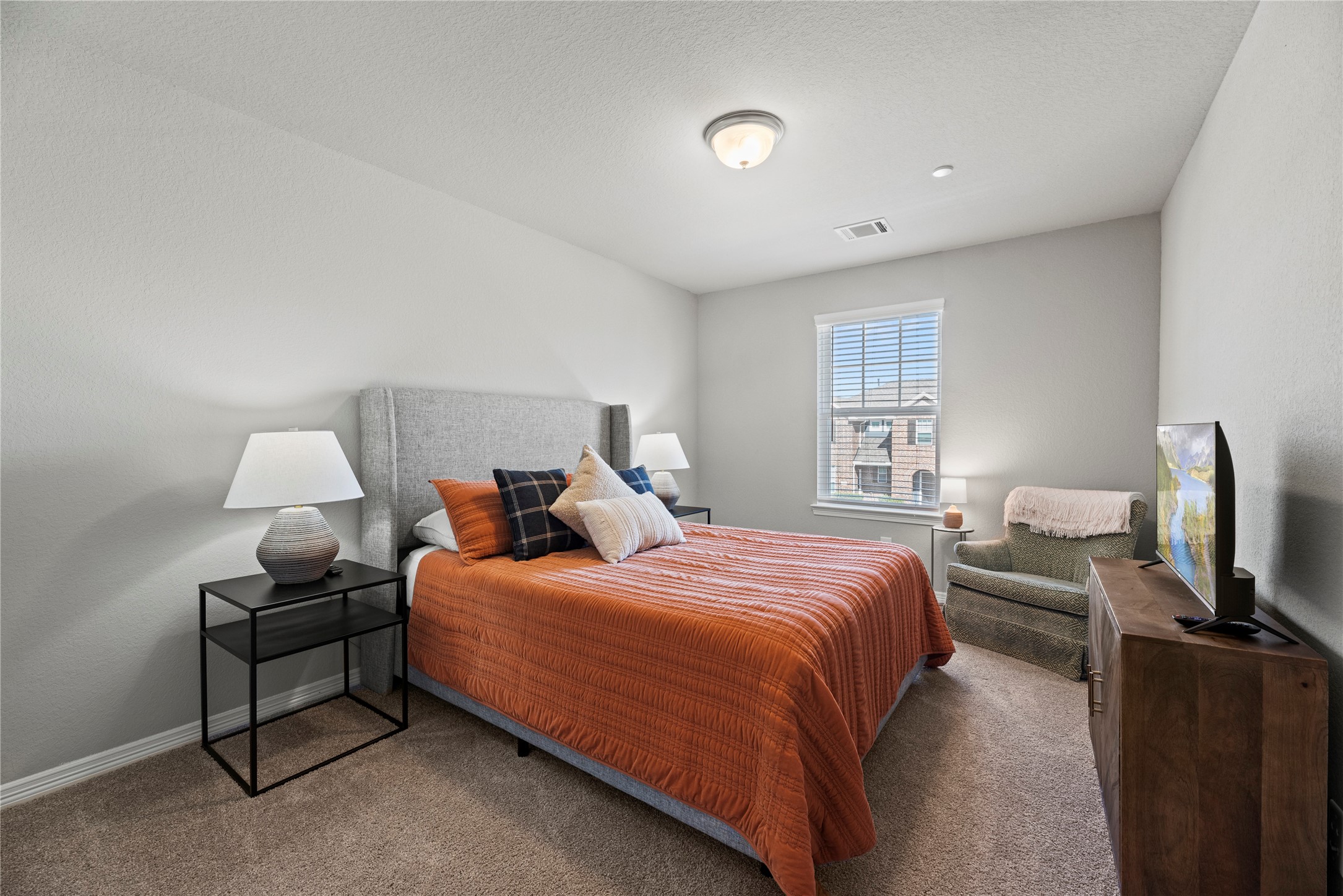 8001 Scanlan Trail Missouri City, TX 77459 - Photo 25 of 41 a bedroom with a bed and flat screen tv