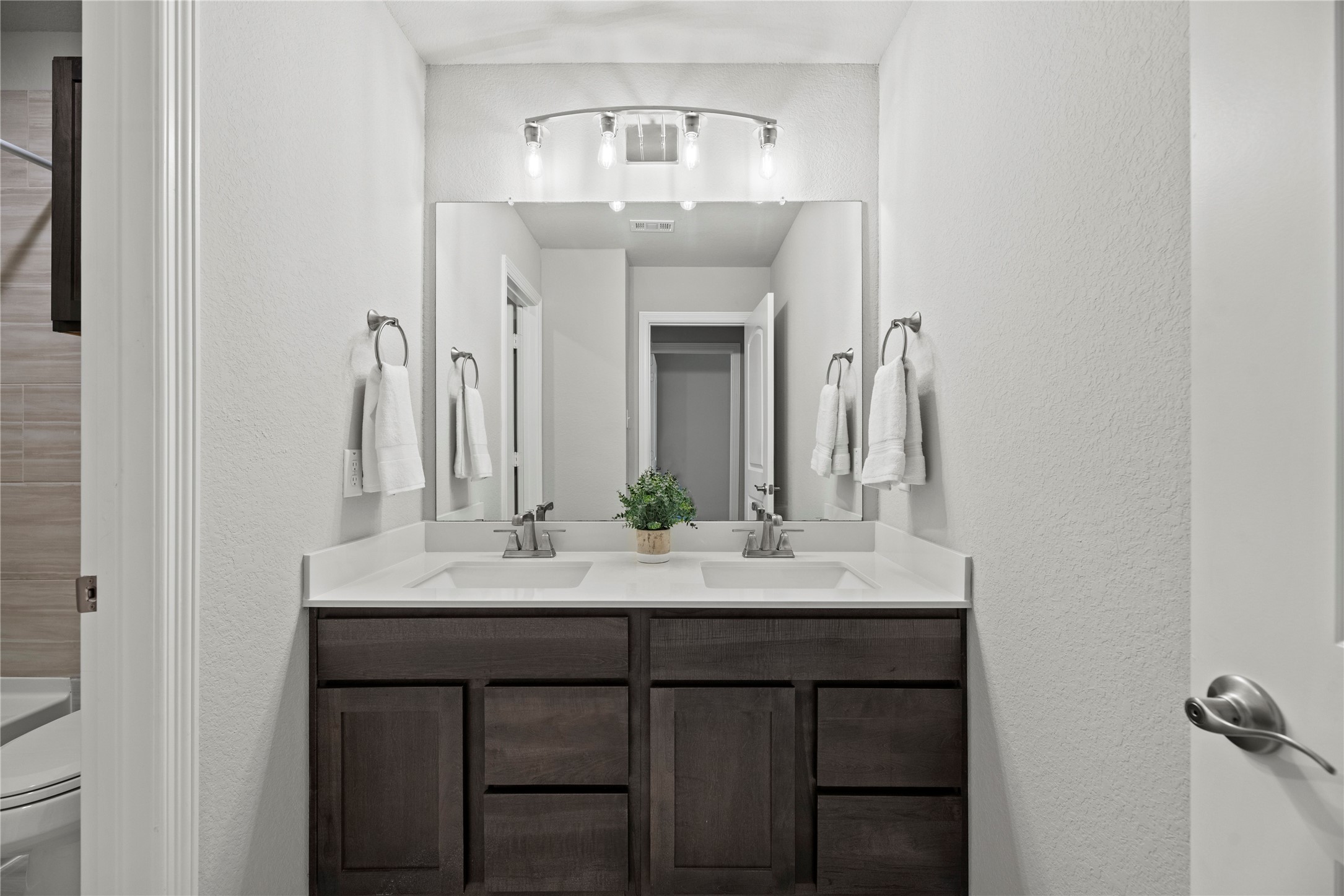 8001 Scanlan Trail Missouri City, TX 77459 - Photo 26 of 41 a bathroom with a sink and a mirror