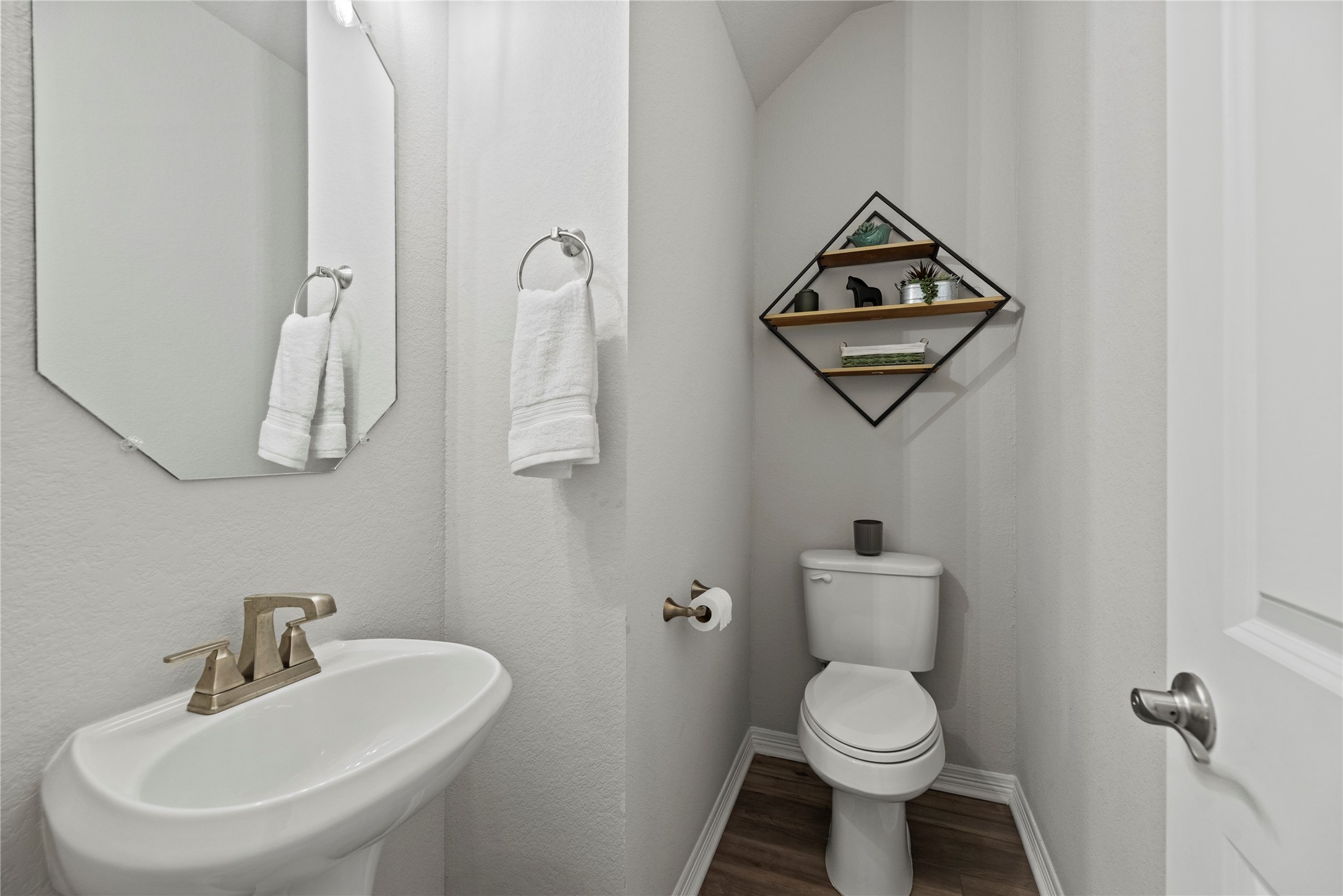 8001 Scanlan Trail Missouri City, TX 77459 - Photo 29 of 41 a white toilet sitting next to a bathroom sink