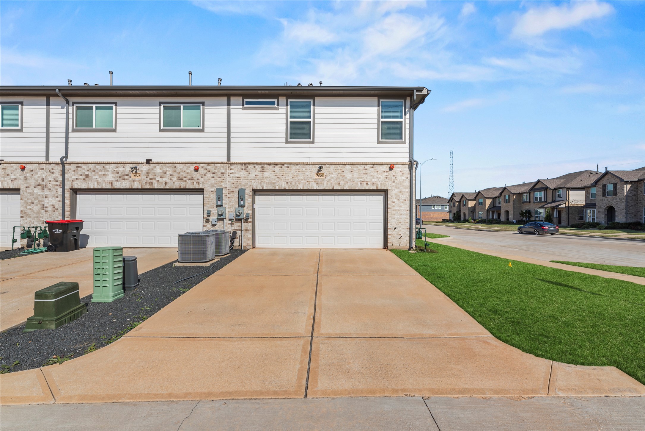 8001 Scanlan Trail Missouri City, TX 77459 - Photo 33 of 41 a front view of a house with a yard and garage